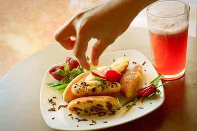 High angle view of person with drink on table