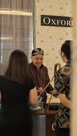 Portrait of young woman playing chess