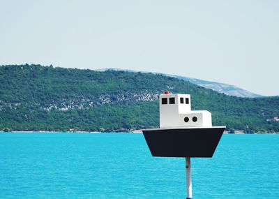 Close-up of blue sea against clear sky