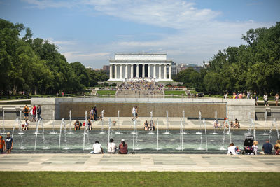 Group of people in front of historical building