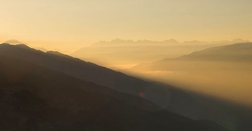 Scenic view of mountains against sky during sunset