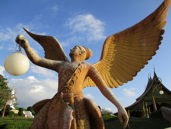 Low angle view of statue against sky