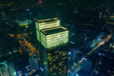 High angle view of illuminated buildings in city at night