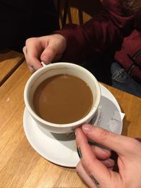 High angle view of coffee cup on table