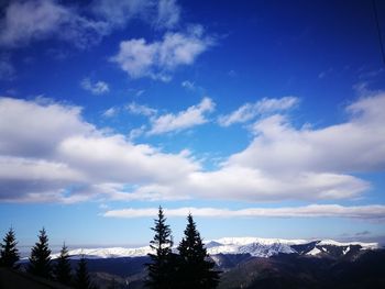 Scenic view of mountains against sky during winter