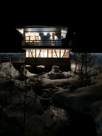 Illuminated building at night during winter