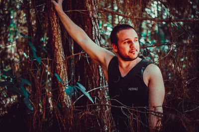 Young man in forest