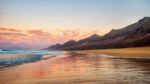 Scenic view of sea against sky during sunset