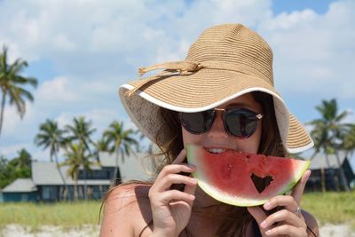 Portrait of woman eating watermelon