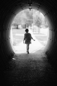 Silhouette of girl in tunnel