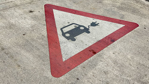 High angle view of arrow sign on road