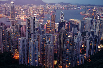 High angle view of illuminated buildings in city at night