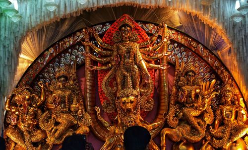 Statue in illuminated temple