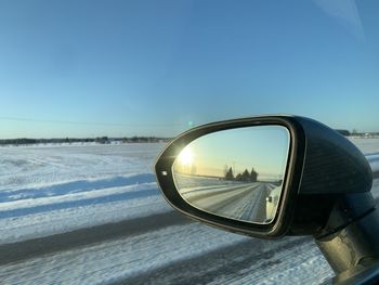 Reflection of car on side-view mirror