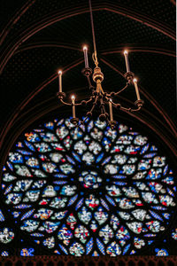 Low angle view of illuminated chandelier