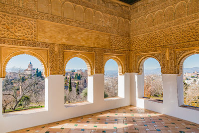 Mirador del generalife in moorish nasrid style seen from its arched windows in the alhambra