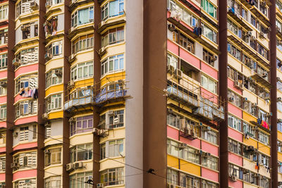 Close-up to a densely populated apartment building in hong kong.