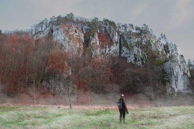 Full length of man standing on field against sky