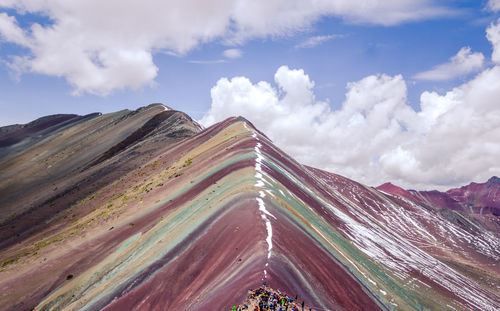 Panoramic rainbow mountain peru view of landscape against cloudy sky 