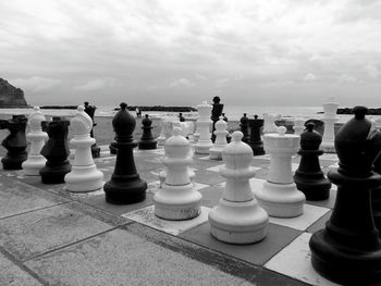 Full frame shot of chess board on sea against sky