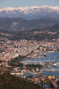 High angle view of townscape by sea