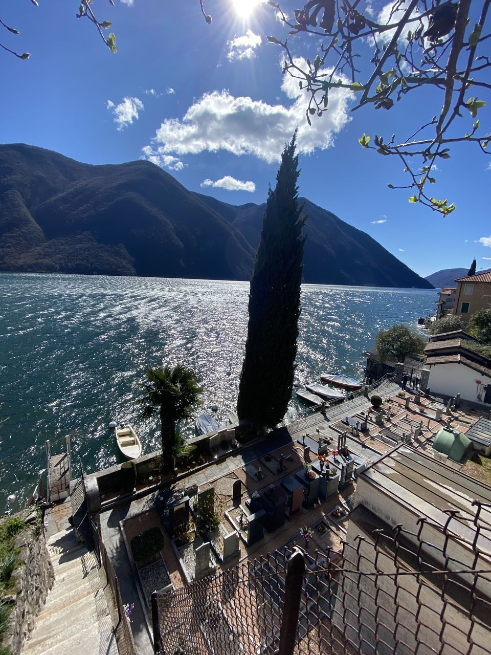 HIGH ANGLE VIEW OF SEA BY MOUNTAIN AGAINST SKY