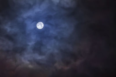 Low angle view of moon against sky at night