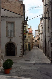 Houses in town against sky