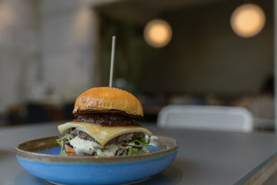 Close-up of burger in plate on table