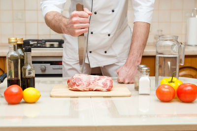 Man preparing food in kitchen at home