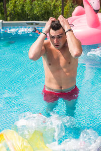 Man swimming in pool