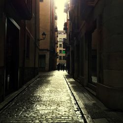 Narrow alley along buildings