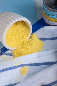 High angle view of yellow cake on table