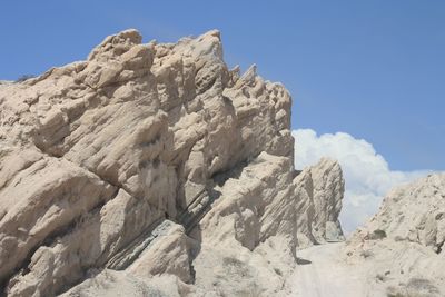 Low angle view of rocks against sky