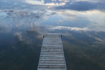 High angle view of pier on lake against sky