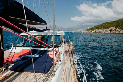 Boat sailing on sea against sky