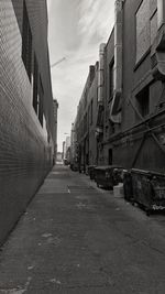 Street amidst buildings in city against sky