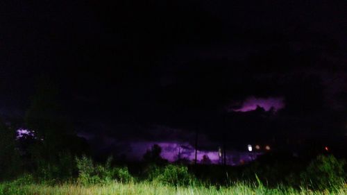 Scenic view of field against sky at night