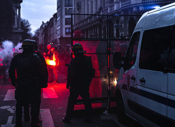 People standing on street in city