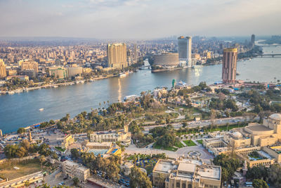 High angle view of river amidst buildings in city