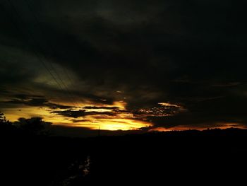 Scenic view of silhouette landscape against sky at sunset