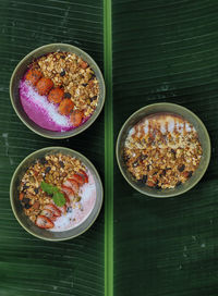 Three ready to eat bowls of strawberry, peanut butter and pitaya muesli