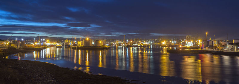 Illuminated city at waterfront