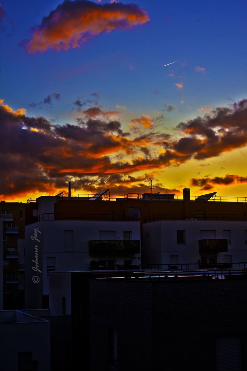 SILHOUETTE OF BUILT STRUCTURES AT SUNSET