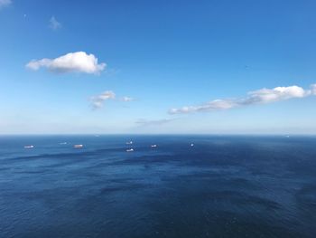 Scenic view of sea against blue sky