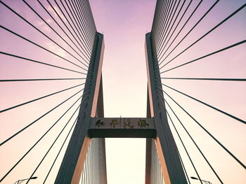 Low angle view of bridge against sky during sunset