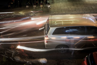 Blurred motion of car on street at night