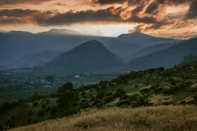 Scenic view of mountains against sky during sunset