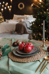 Serving a festive christmas table in scandinavian style. decor on the table before the holiday