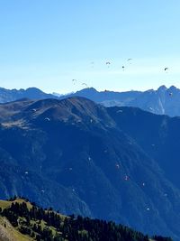 Scenic view of mountains against clear blue sky